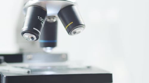 Closeup of Scientific Microscope Laboratory in Hospital Epidemic Disease Healthcare Vaccine Research