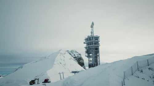 Tower with antennas in snow on Titlis mountain in Switzerland