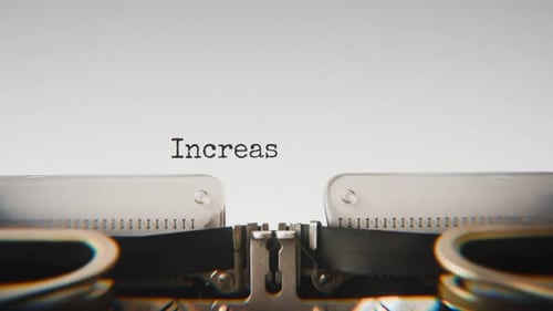 Old mechanical typewriter typing Increase Your Wealth in a close-up view.