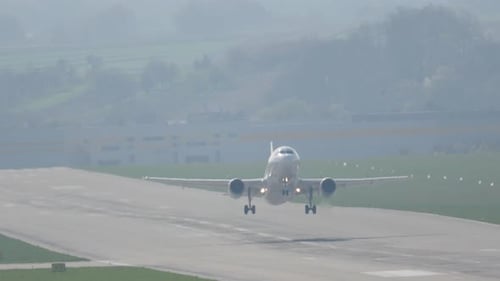 Airplane takes off from runway, soaring into the sky for a new adventure