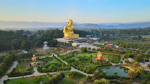 4k Stunning statue of Ganesha and biggest Luang Pu Thuat in the world. pan around an elephant-headed