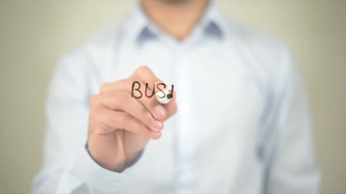 Man Writing Business Consulting on Clear Surface