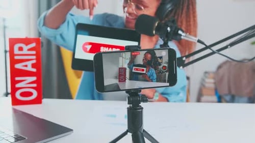 Woman Recording Content on Smartphone