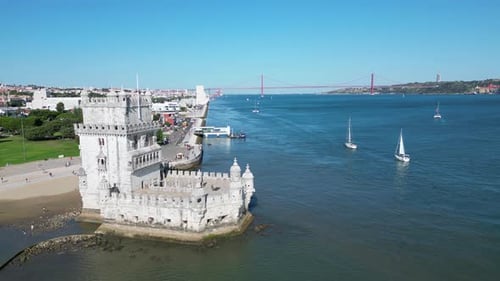 Belem Tower (Torre de Belém) in Portugal and the Sun's Glow Over the Tagus.