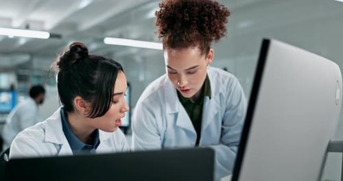 Scientists Collaborating on Research in Modern Laboratory