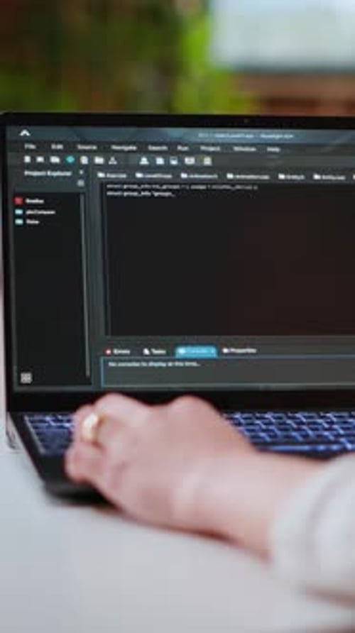 Vertical Video Asian Female Programmer Works on Coding Software in a Home Office Setup