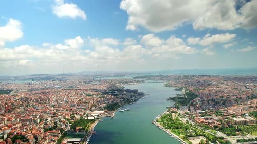 Aerial drone view of Istanbul, Turkey. Halic Bridge with multiple moving cars, multiple residential