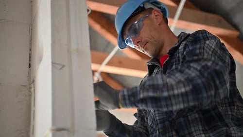 Electric Contractor Worker Installing Wall Switch Point