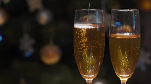 Champagne Pour by Christmas Tree Lights