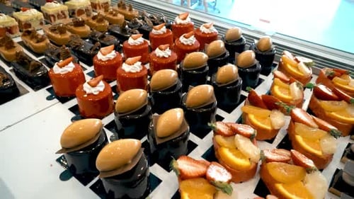 Assortment of Colourful Cakes in Display Case