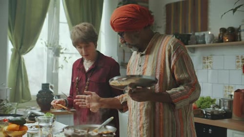 People Cooking Together in Kitchen at Home