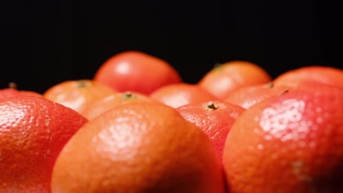 Close up shot of vibrant tangerines with dolly movement