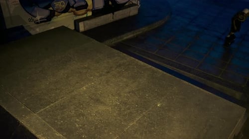 Young Skater Riding Skateboard at Urban City Night Skate Park. Active Man