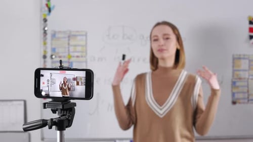 Teacher Records Online Lesson in Classroom