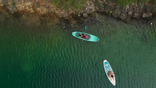 Aerial View Exploring a Vast Green Canyon on Paddleboards