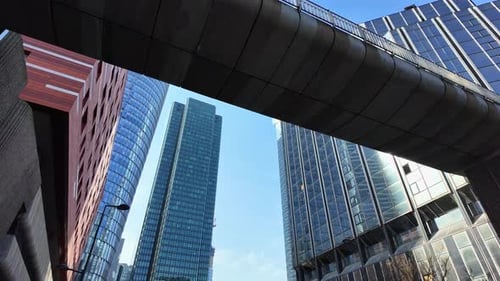 Low-angle pov of La Defense skyscrapers, Paris. First-person walking view