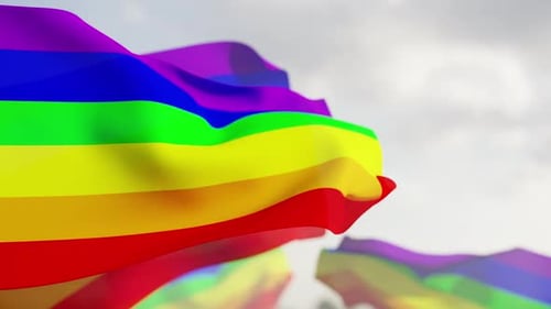Waving Rainbow Pride Flags with Blue Sky