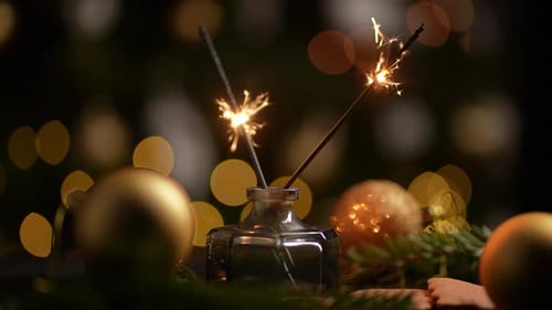 Festive Sparklers and Gold Ornaments for Christmas