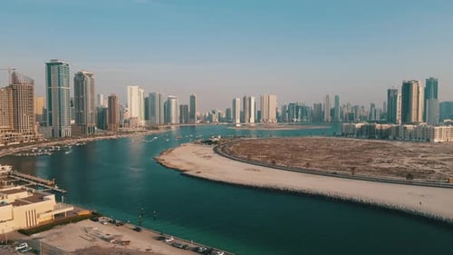 Aerial video over the Creek River and the city skyscrapers in Dubai