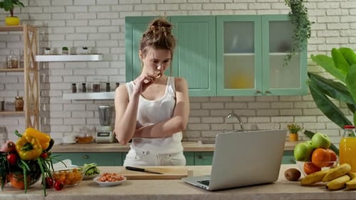 Young Woman at the Table in the Kitchen Preparing Spring Rolls for Healthy Lunch Woman Cutting
