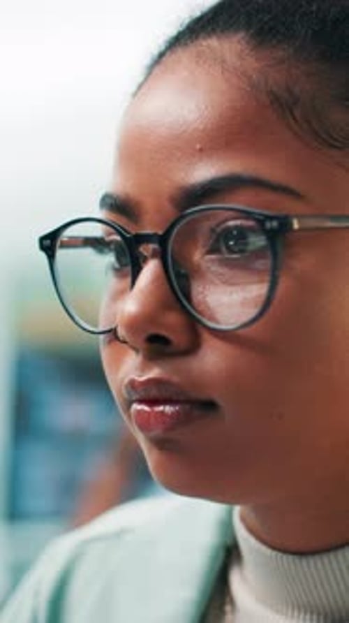 Woman with Glasses Working on a Computer