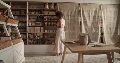Woman with Tablet Working in Eco Shop