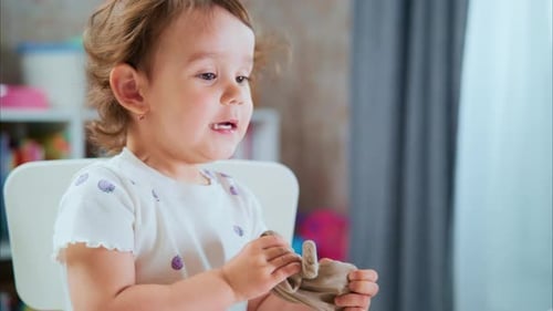 Excited Girl Playing with Clay Indoors at Home