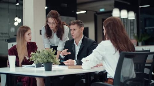 Teamwork of a Group of Business People in the Office Unhurried Discussion of Plans and Tasks