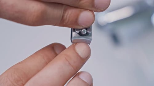 Close Up: Man Clipping His Fingernails at Home