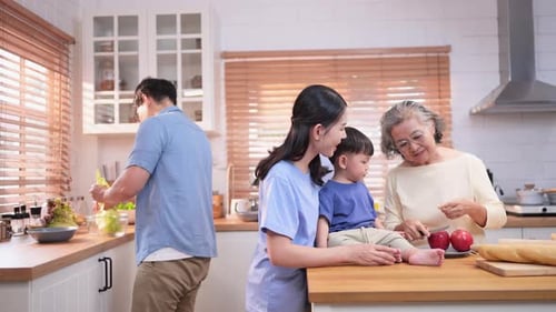 Family Prepares Food Together in Bright Kitchen