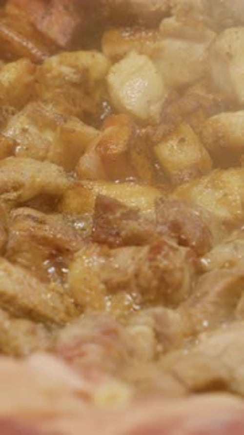 Delicious Pork Cubes Frying Close Up