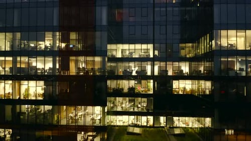 Panoramic Drone Shot of LateNight Business in a Glass Skyscraper