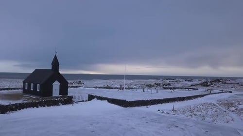 View Over a Church in the Middle of the Snow at the Seaside