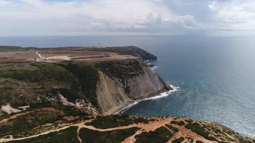 Aerial drone view of lighthouse on Cabo Espichel cape Espichel on Atlantic ocean