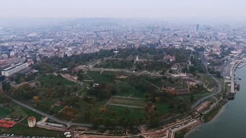 Drone footage showcases Kalemegdan Fortress surrounded by greenery, historic walls, and city