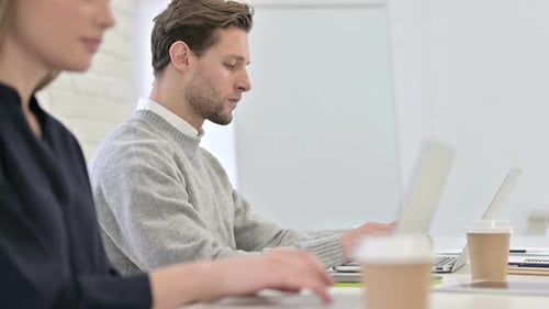 Close up of Creative Startup Team Working on Laptops in Office