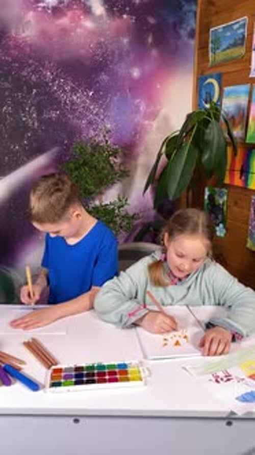 Children Drawing Together at Home
