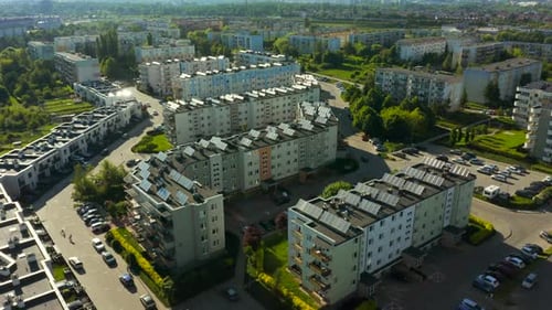 Aerial View of Suburban Apartments with Solar Panels