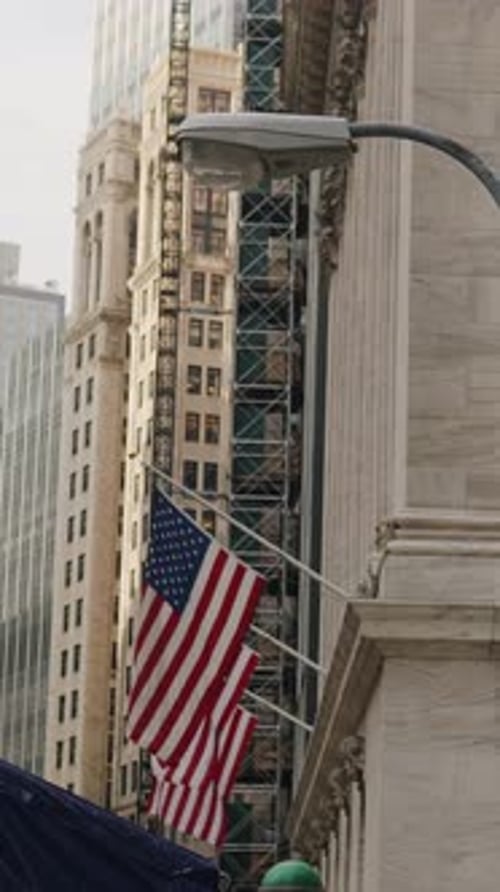 American flags in New York Financial District. Vertical Video.