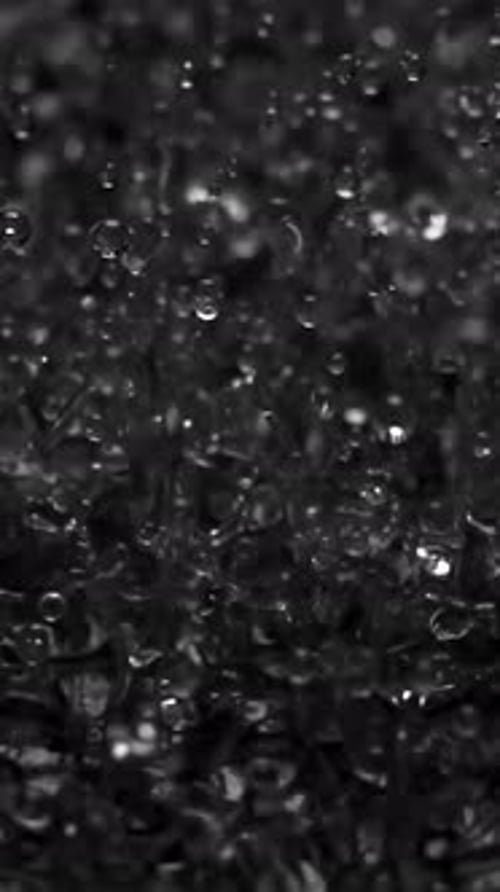 Water Droplets Falling in Vertical Black and White