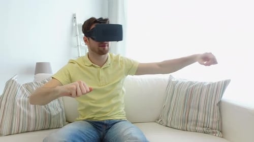 Man wearing VR headset interacting with virtual reality