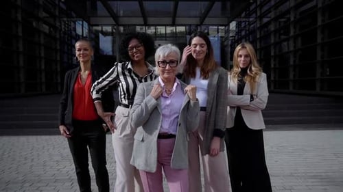 Confident Businesswomen Posing in Front of Office Building