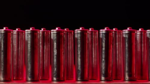 Row of Batteries Lit with Red Light