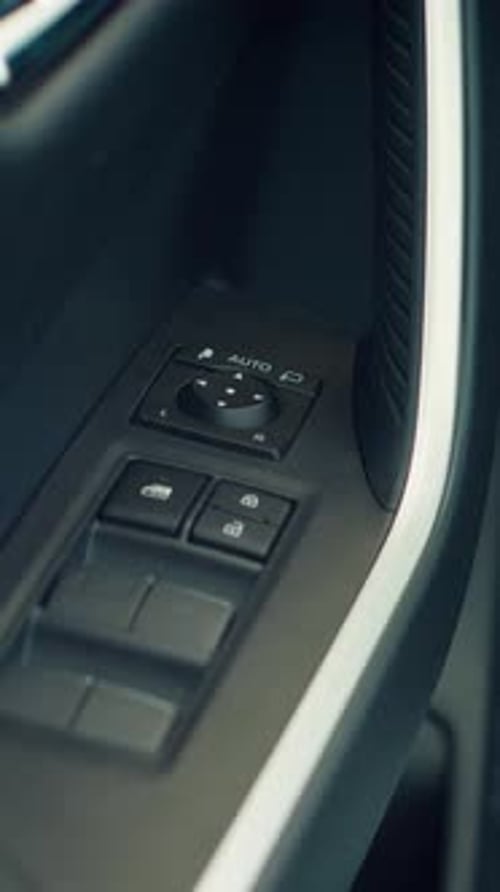 Vertical Video Details Close Up Shot of Car Door Lock Controls