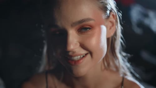 Woman Posing with Makeup in the Dark