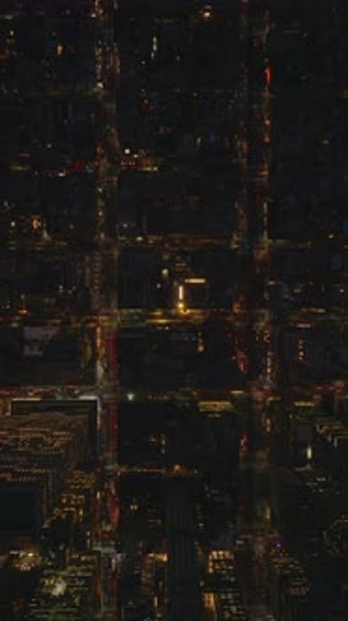 Vertical Aerial View of Manhattan New York City Showcasing Streets at Night in Slow Motion The Slow