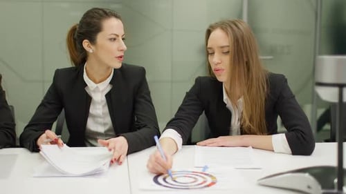 Two Women Meeting in Conference Room