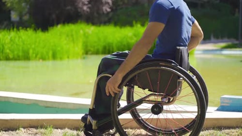 Close-up of disabled person in wheelchair.