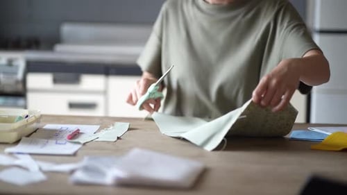 Young Adult Cutting Fabric for Sewing Project