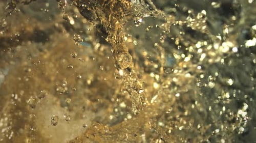 Juicy freshness explosion. Healthy natural juice splashing in extreme slow-motion. Dramatic close-up